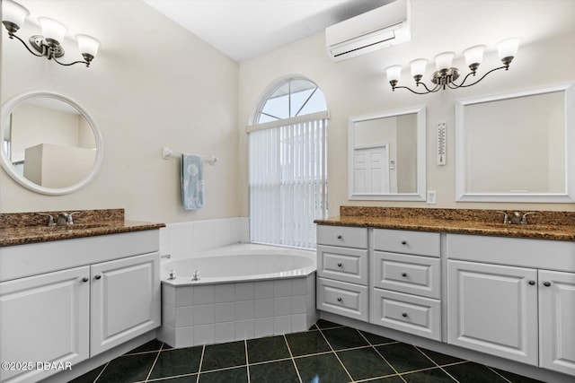 bathroom featuring tile patterned floors, tiled tub, vanity, and an AC wall unit