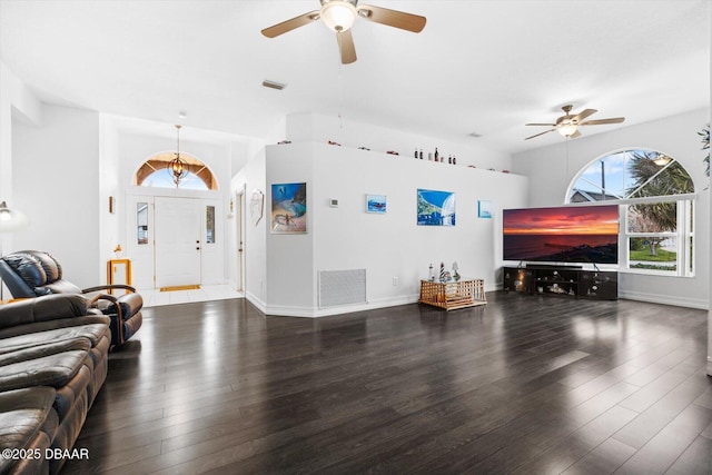 living room featuring ceiling fan and dark hardwood / wood-style floors