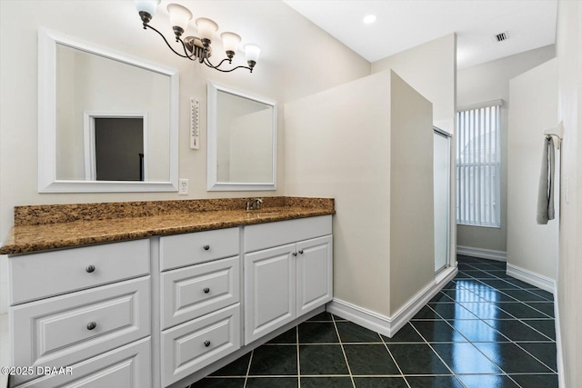 bathroom with vanity, tile patterned floors, and walk in shower