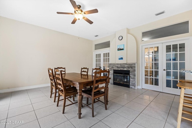 tiled dining space with french doors and ceiling fan