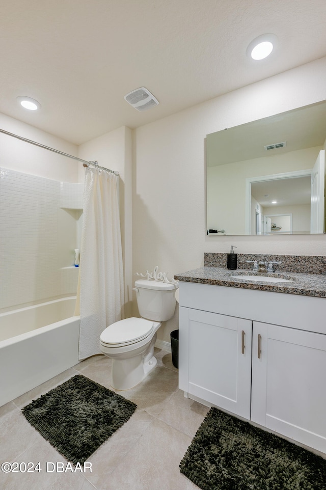 full bathroom with toilet, vanity, shower / bath combo with shower curtain, and tile patterned floors