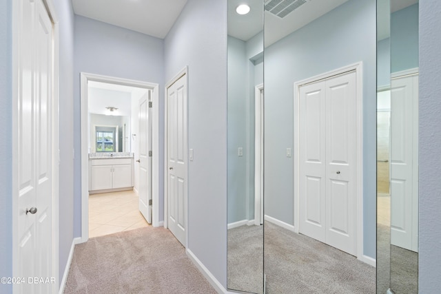 798 Jollymon Way, Daytona Beach, FL 32124 - hallway featuring light colored carpet and baseboards