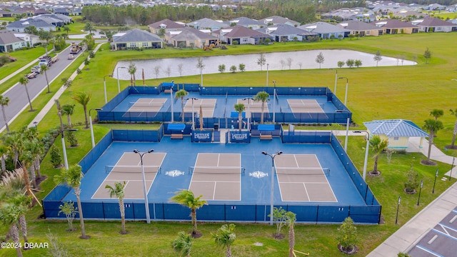 birds eye view of property with a water view and a residential view