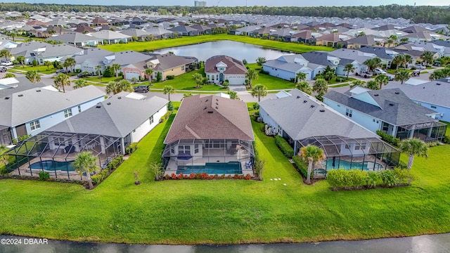 bird's eye view with a residential view and a water view