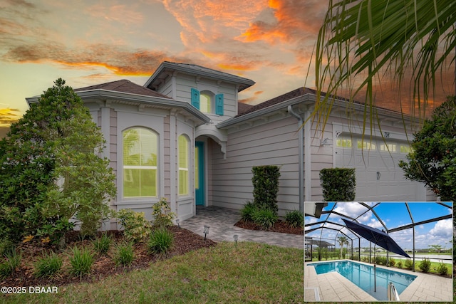 798 Jollymon Way, Daytona Beach, FL 32124 - view of front of house with a lanai, an outdoor pool, and a shingled roof