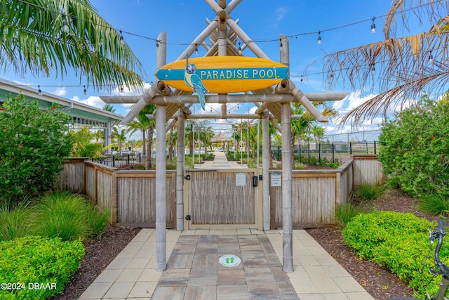 view of patio featuring fence and a gate