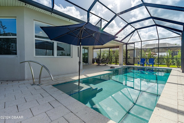 outdoor pool featuring a patio and a lanai