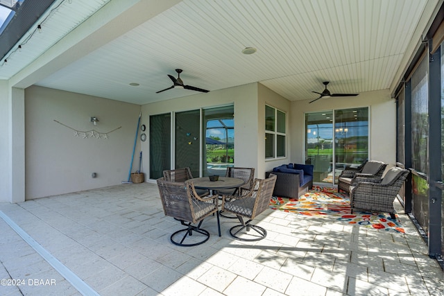 view of patio featuring ceiling fan, an outdoor hangout area, and outdoor dining space