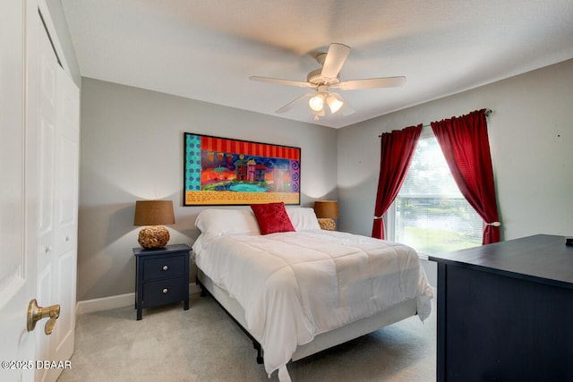 1245 Hampstead Ln, Ormond Beach, FL 32174 - bedroom featuring light colored carpet, a closet, a ceiling fan, and baseboards