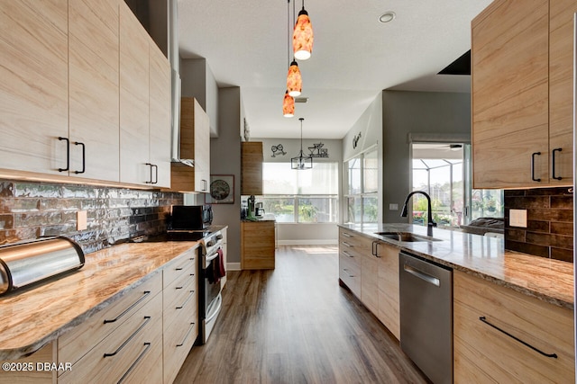 1245 Hampstead Ln, Ormond Beach, FL 32174 - kitchen with a sink, stainless steel appliances, dark wood-type flooring, modern cabinets, and tasteful backsplash