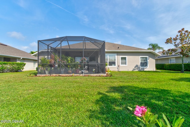 1245 Hampstead Ln, Ormond Beach, FL 32174 - rear view of house with a lawn, stucco siding, and a lanai
