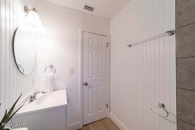 bathroom featuring wood-type flooring and vanity