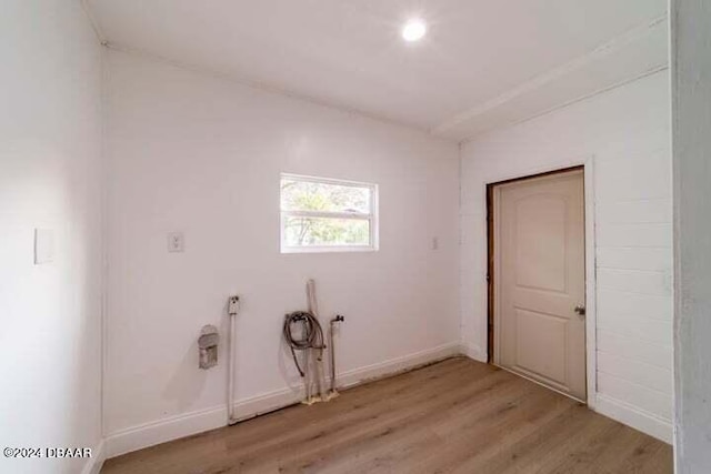 laundry area with light hardwood / wood-style floors