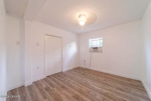 unfurnished room featuring hardwood / wood-style floors