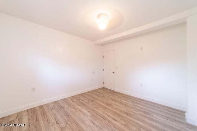 spare room with light hardwood / wood-style flooring