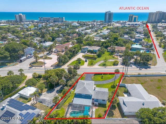 birds eye view of property with a water view