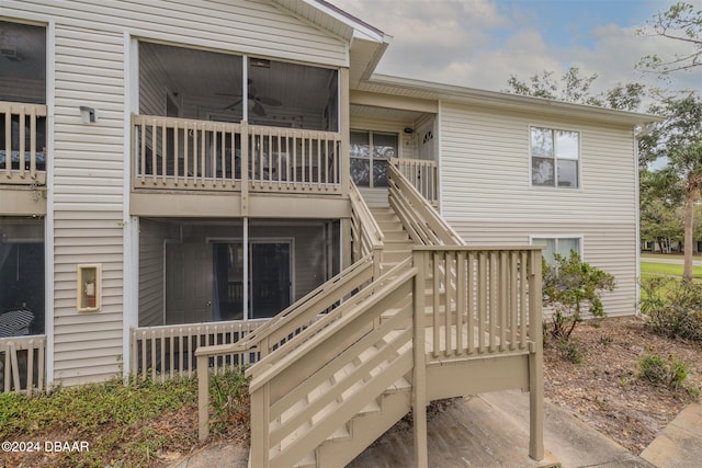 rear view of house with ceiling fan