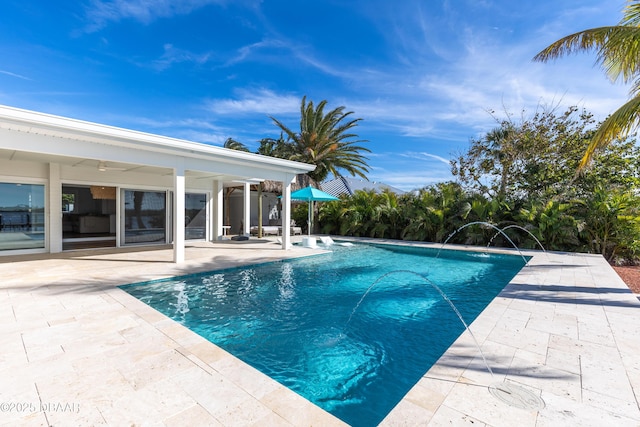 view of swimming pool featuring a patio and pool water feature