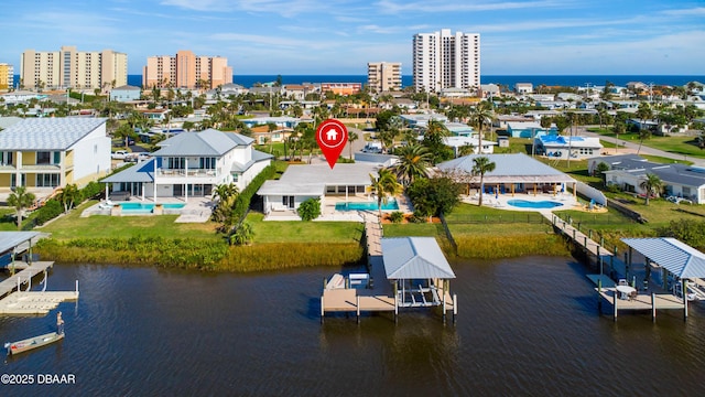 birds eye view of property featuring a water view