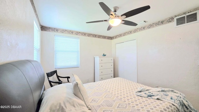 52 Palm Dr, Ormond Beach, FL 32176 - bedroom featuring a ceiling fan and a closet