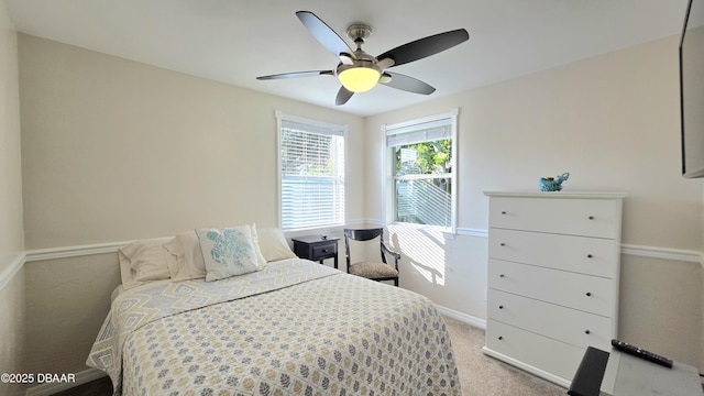 52 Palm Dr, Ormond Beach, FL 32176 - bedroom with light colored carpet and ceiling fan