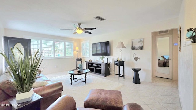 52 Palm Dr, Ormond Beach, FL 32176 - living area with ceiling fan and light tile patterned floors