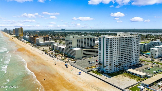 drone / aerial view with a view of the beach and a water view