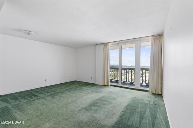 empty room featuring carpet flooring