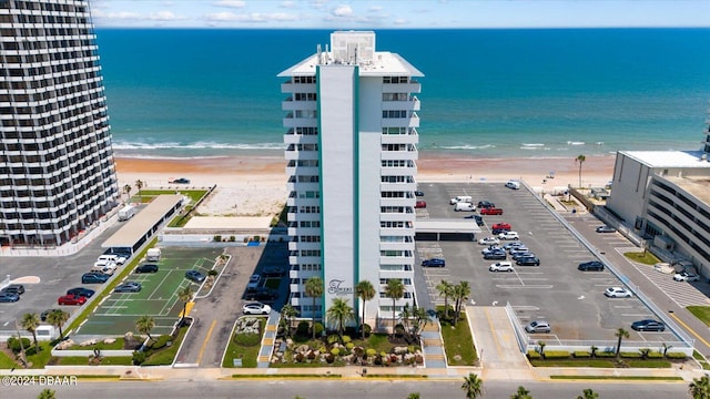 drone / aerial view with a water view and a view of the beach