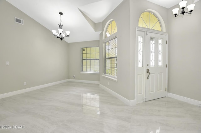 foyer with baseboards, high vaulted ceiling, visible vents, and an inviting chandelier