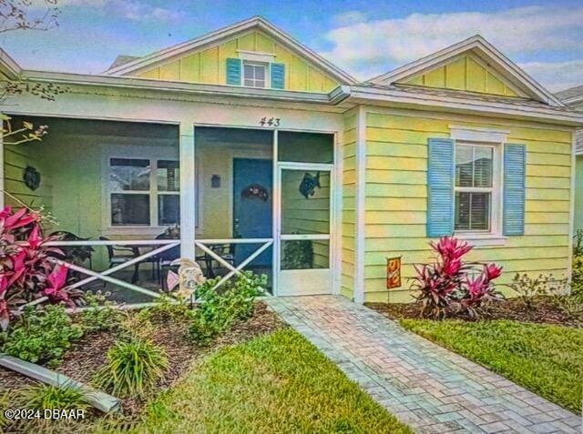 view of front of property featuring a sunroom