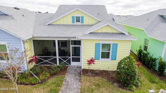 back of property featuring a sunroom