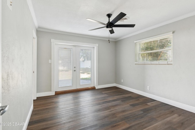 spare room featuring dark hardwood / wood-style floors, ceiling fan, a wealth of natural light, and french doors