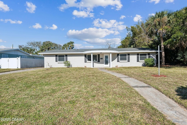 ranch-style house featuring a front lawn