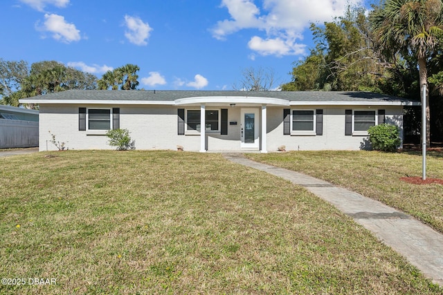 ranch-style home with a front lawn