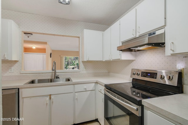 kitchen with sink, white cabinets, and stainless steel appliances