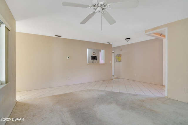 36 Summer Trees Rd, Port Orange, FL 32128 - carpeted spare room featuring tile patterned flooring and a ceiling fan