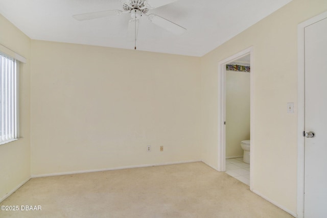 unfurnished room featuring ceiling fan and light colored carpet