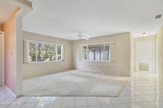 36 Summer Trees Rd, Port Orange, FL 32128 - carpeted empty room with tile patterned floors and ceiling fan