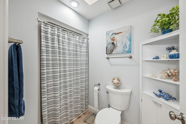 bathroom featuring toilet and hardwood / wood-style floors