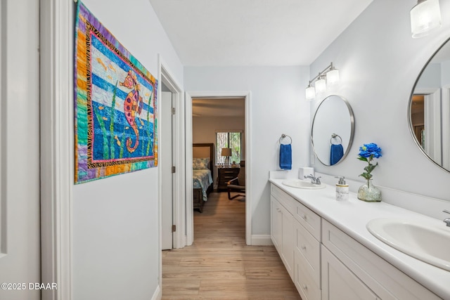 bathroom with wood-type flooring and vanity