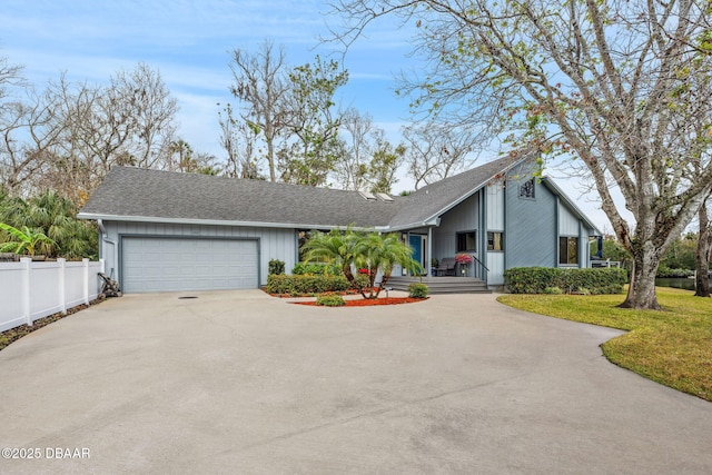 view of front of home with a front lawn and a garage