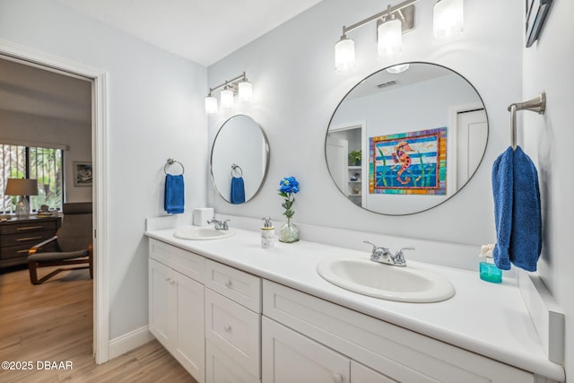 bathroom with wood-type flooring and vanity