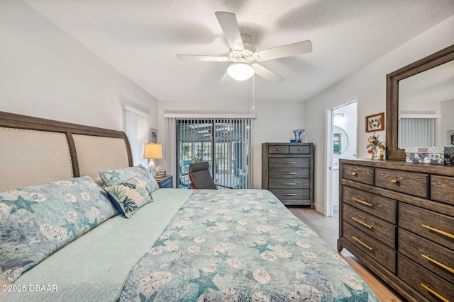 bedroom featuring ceiling fan, access to outside, light wood-type flooring, and a textured ceiling