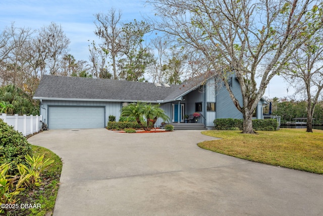 view of front facade with a front lawn and a garage