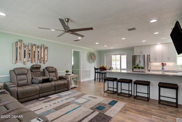 2917 Carriage Dr, South Daytona, FL 32119 - living room featuring ceiling fan, ornamental molding, recessed lighting, and wood finished floors