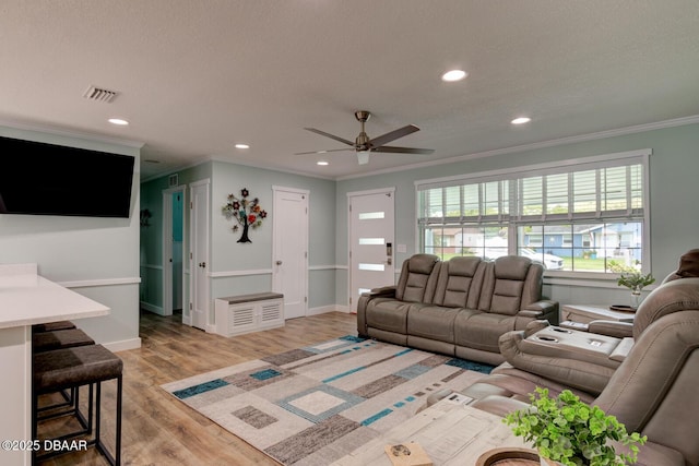 2917 Carriage Dr, South Daytona, FL 32119 - living area with light wood finished floors, ornamental molding, a ceiling fan, and recessed lighting