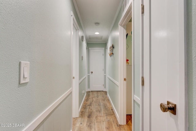 2917 Carriage Dr, South Daytona, FL 32119 - corridor featuring light wood finished floors, ornamental molding, and attic access