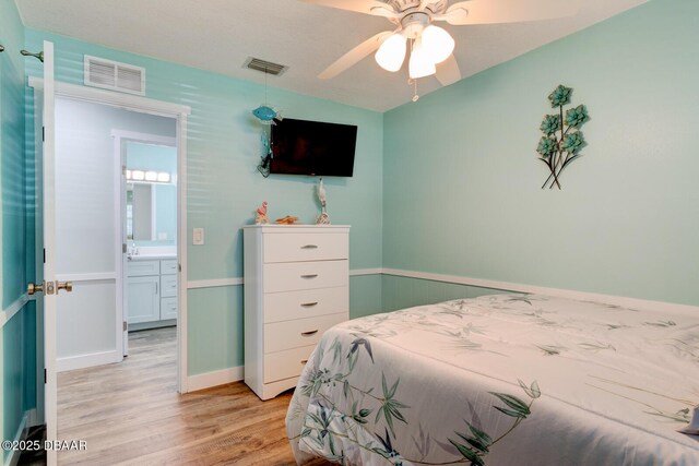 2917 Carriage Dr, South Daytona, FL 32119 - bedroom with light wood-style floors and a ceiling fan