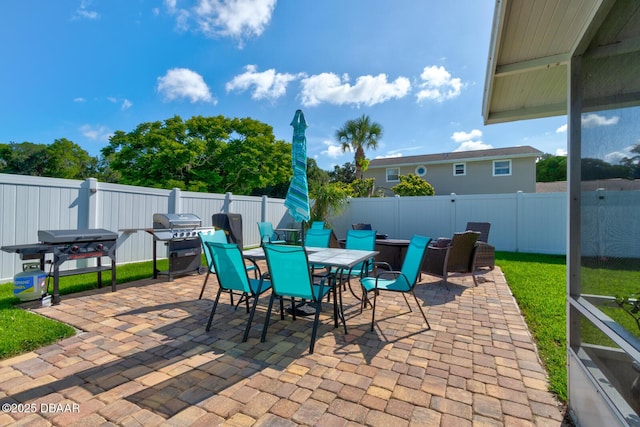 2917 Carriage Dr, South Daytona, FL 32119 - fenced backyard featuring outdoor dining space, a patio, and grilling area